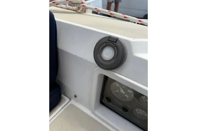 Star Yacht Photos Pics Control panel of a 1998 Sabre 402 sailboat with gauges and a power socket.