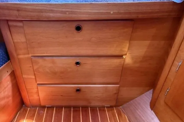 Star Yacht Photos Pics Wooden drawers in a 1998 Sabre 402 boat interior, featuring sleek design and craftsmanship.