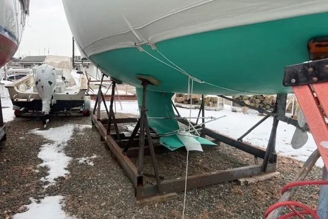 Star Yacht Photos Pics 1998 Sabre 402 sailboat on stands, green hull, winter storage setting.