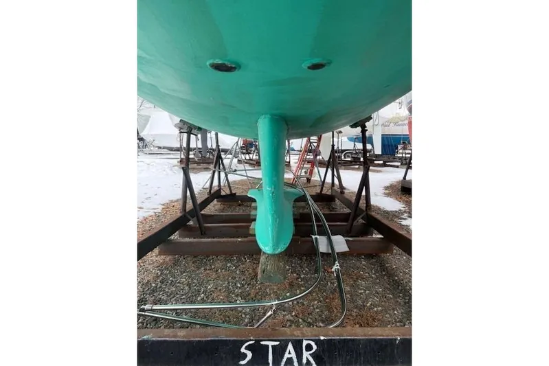 Star Yacht Photos Pics Bottom view of a 1998 Sabre 402 sailboat on a stand, showing keel and rudder.