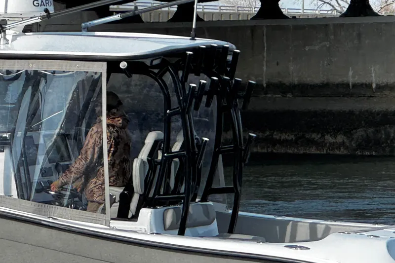  Yacht Photos Pics 2024 Cape Horn 32 T boat with person navigating, featuring modern design and equipment.