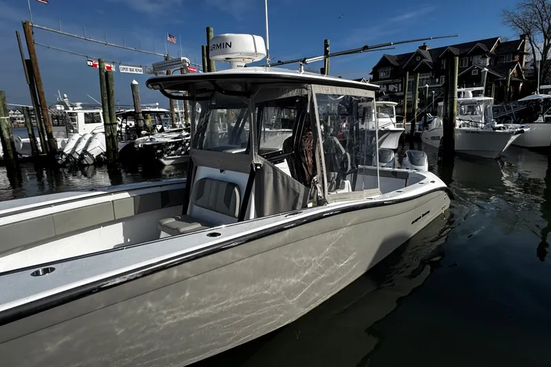  Yacht Photos Pics 2024 Cape Horn 32 T boat docked at marina, featuring sleek design and advanced navigation equipment.