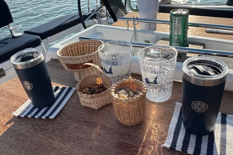 Squeeze De Citron Yacht Photos Pics Outdoor table on 2023 Dufour 37 yacht with drinks and snacks.