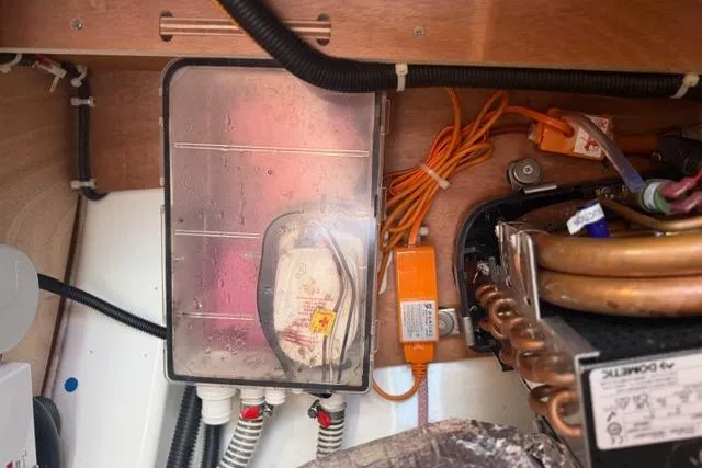 Squeeze De Citron Yacht Photos Pics Electrical components inside a 2023 Dufour 37 yacht, featuring wiring and control systems.