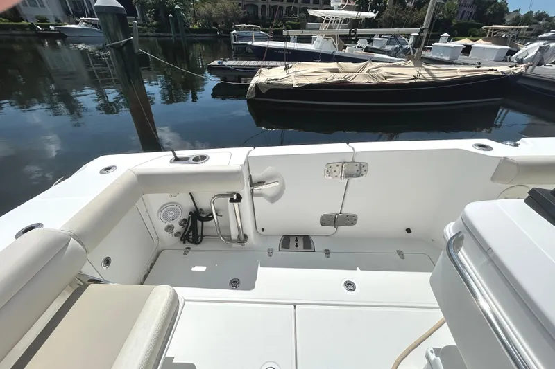 Yacht Photos Pics 2017 Boston Whaler 330 Outrage boat interior, docked in a marina.