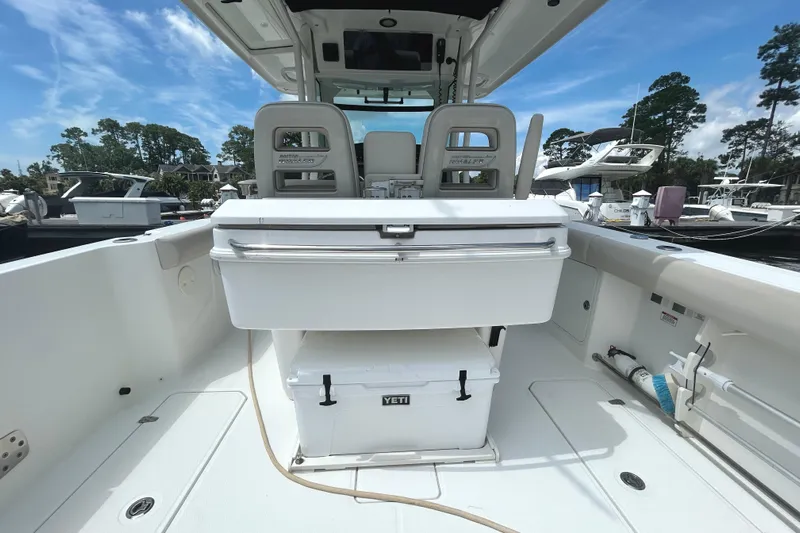  Yacht Photos Pics 2017 Boston Whaler 330 Outrage boat interior with seating and Yeti cooler.