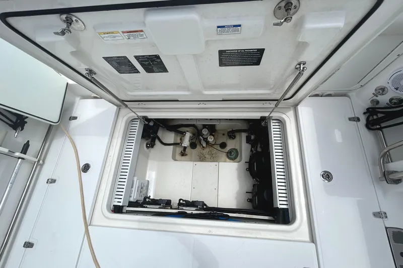  Yacht Photos Pics 2017 Boston Whaler 330 Outrage engine compartment, open hatch view.