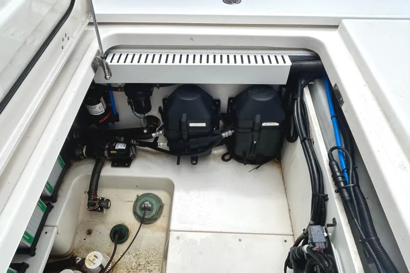  Yacht Photos Pics 2017 Boston Whaler 330 Outrage engine compartment with visible wiring and components.