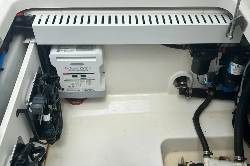  Yacht Photos Pics 2017 Boston Whaler 330 Outrage engine compartment with ProNautic 12-30P charger and wiring.