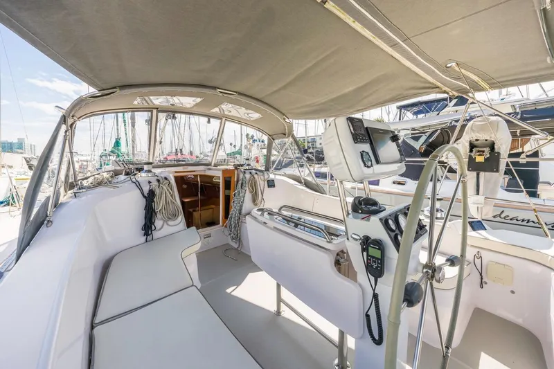 Nina Mia Yacht Photos Pics 2018 Catalina 385 yacht cockpit with steering wheel, navigation equipment, and seating area.