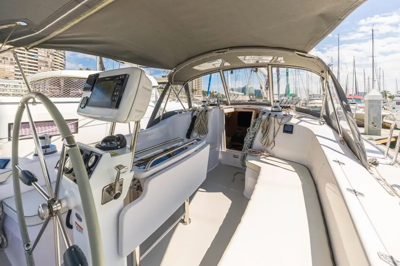 Nina Mia Yacht Photos Pics 2018 Catalina 385 sailboat cockpit with navigation equipment, docked in a marina.