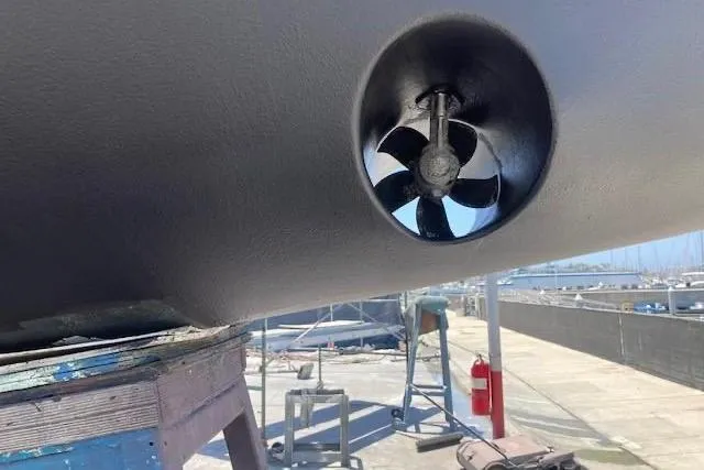 Nina Mia Yacht Photos Pics Bow thruster on a 2018 Catalina 385 sailboat in a shipyard setting.