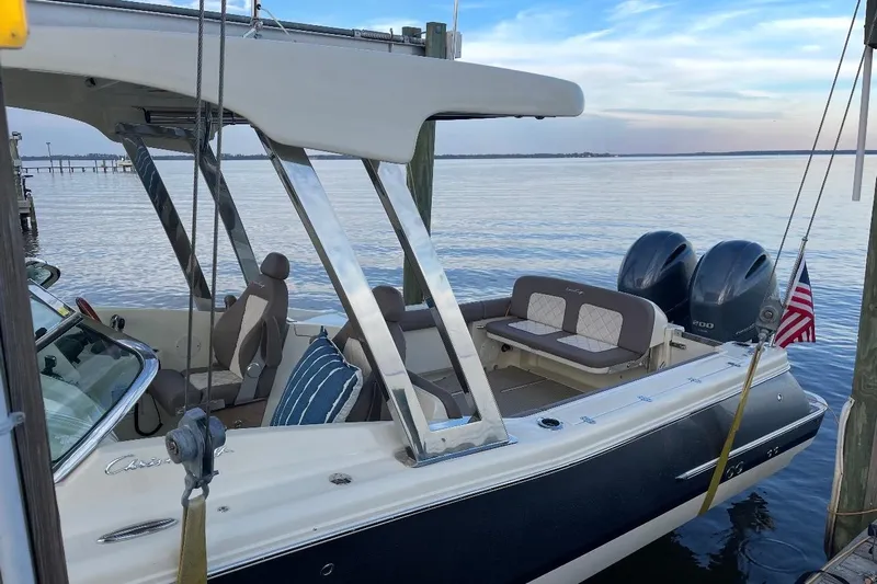  Yacht Photos Pics 2019 Chris-Craft Calypso 26 boat docked, featuring dual engines and a spacious seating area.