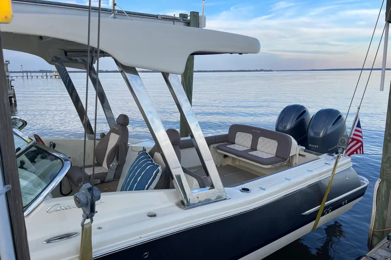  Yacht Photos Pics 2019 Chris-Craft Calypso 26 boat docked, featuring dual engines and elegant seating.