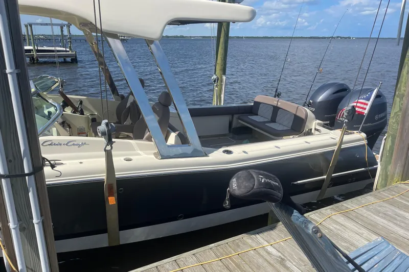  Yacht Photos Pics 2019 Chris-Craft Calypso 26 boat docked, featuring dual Yamaha engines and fishing rods.