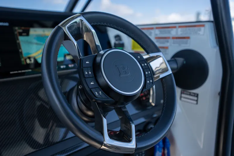 Kraken Yacht Photos Pics Steering wheel of 2023 Axopar SHADOW 900ST with controls.