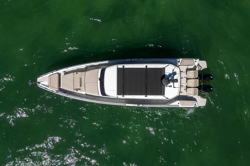 Kraken Yacht Photos Pics Aerial view of 2023 Axopar SHADOW 900ST on green water.