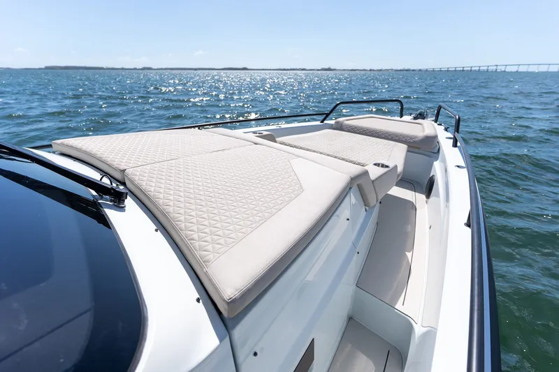 Kraken Yacht Photos Pics Axopar SHADOW 900ST 2023 with luxurious sun loungers on the water.