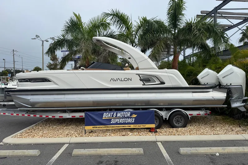  Yacht Photos Pics 2026 Avalon Excalibur 27' boat on trailer, displayed at Boat & Motor Superstores.