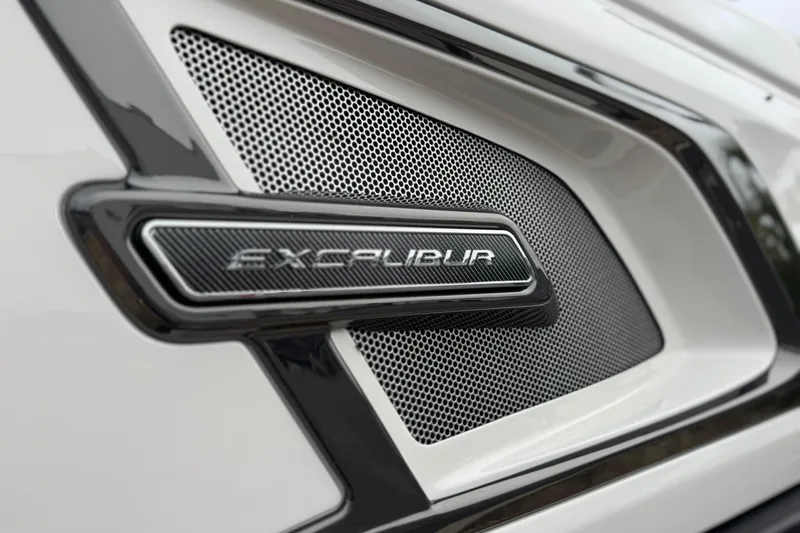  Yacht Photos Pics Close-up of 2026 Avalon Excalibur 27' logo on a sleek, modern grille design.