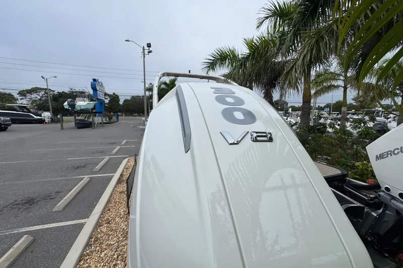  Yacht Photos Pics 2026 Avalon Excalibur 27' boat with 300 V8 engine, parked near palm trees.