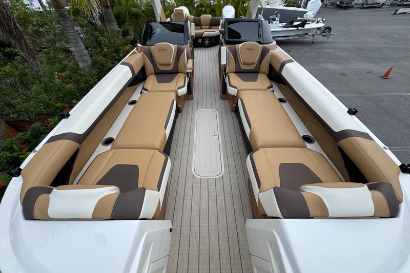  Yacht Photos Pics Luxurious interior of 2026 Avalon Excalibur 27' boat with tan and brown seating.