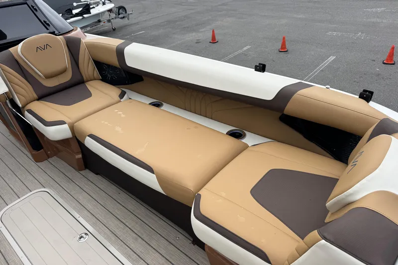  Yacht Photos Pics Luxurious seating on 2026 Avalon Excalibur 27' boat, featuring tan and brown upholstery.