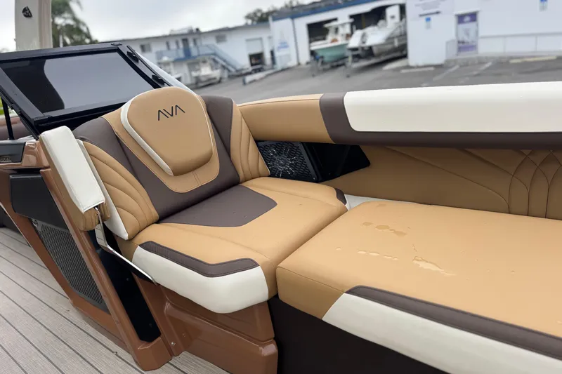  Yacht Photos Pics Luxurious seating on 2026 Avalon Excalibur 27' boat, featuring tan and brown upholstery.
