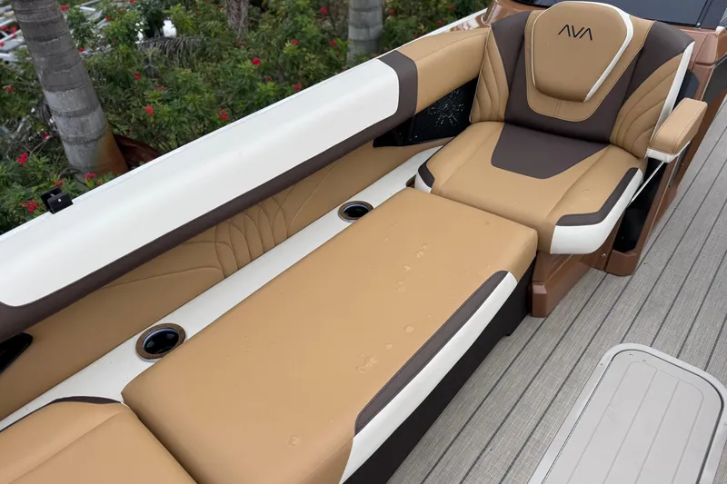  Yacht Photos Pics Luxurious seating on 2026 Avalon Excalibur 27' boat with tan and brown upholstery.