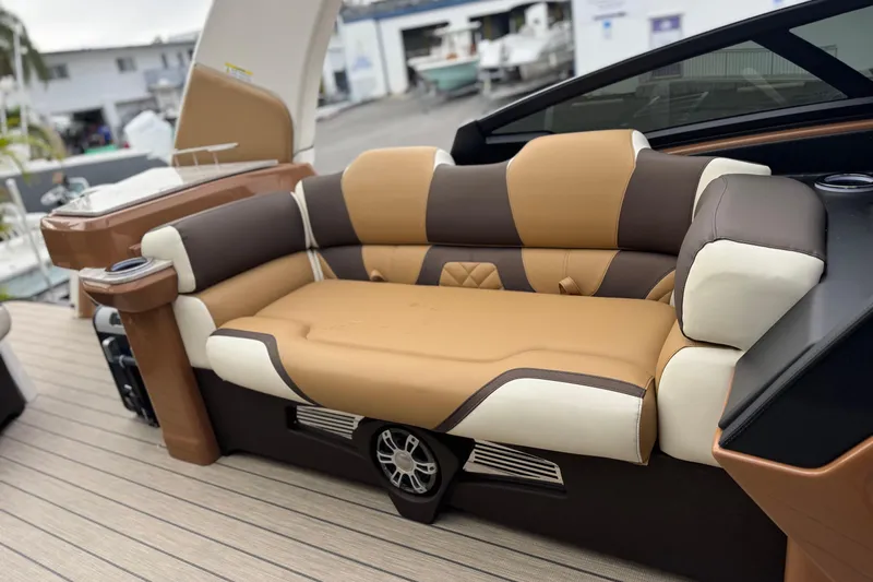  Yacht Photos Pics Luxurious seating on 2026 Avalon Excalibur 27' boat with tan and brown upholstery.