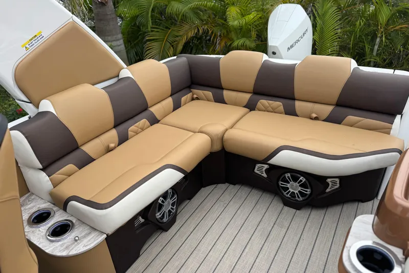  Yacht Photos Pics Luxurious seating on 2026 Avalon Excalibur 27' boat with tan and brown upholstery.