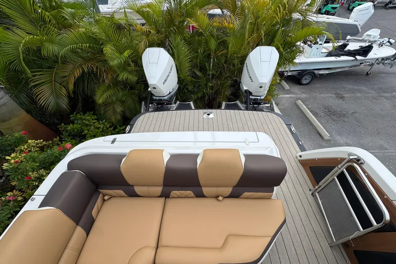  Yacht Photos Pics 2026 Avalon Excalibur 27' boat with tan seating and dual Mercury outboard engines.