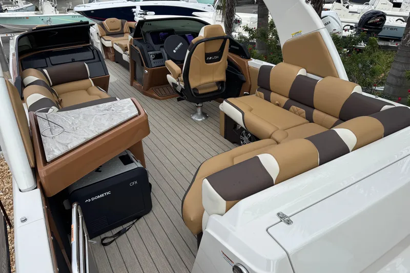  Yacht Photos Pics Luxurious 2026 Avalon Excalibur 27' boat interior with plush seating and modern amenities.