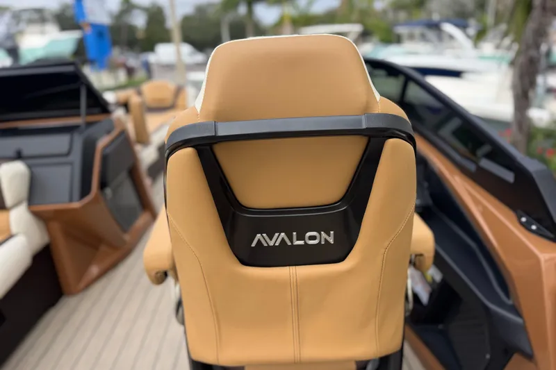  Yacht Photos Pics Luxurious Avalon Excalibur 27' boat seat, 2026 model, with tan upholstery and sleek design.