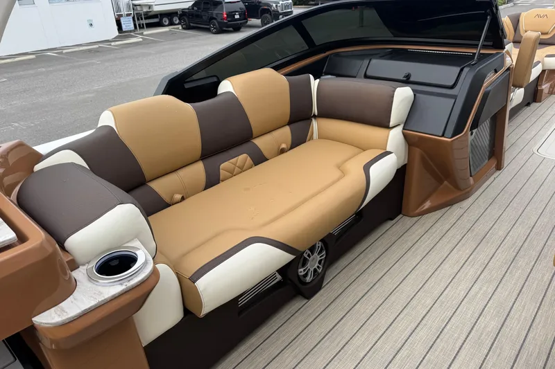  Yacht Photos Pics Luxurious seating on 2026 Avalon Excalibur 27' boat with brown and cream upholstery.
