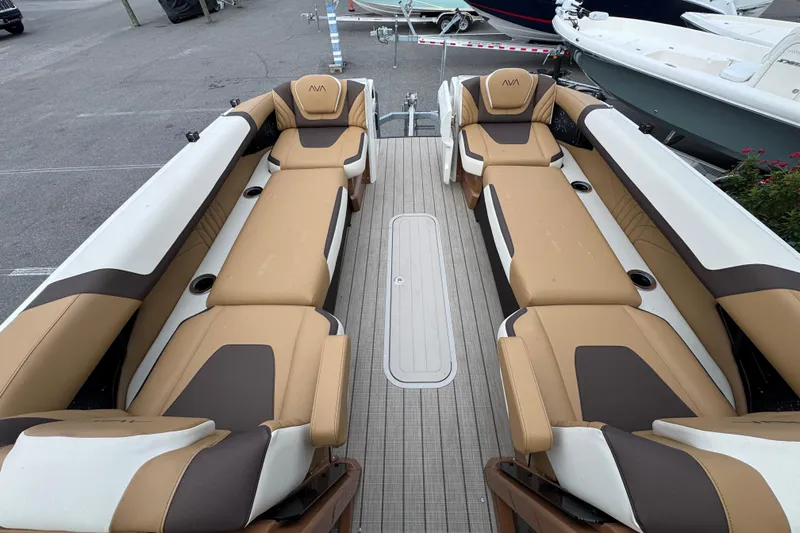  Yacht Photos Pics Luxurious seating on 2026 Avalon Excalibur 27' boat, featuring tan and brown upholstery.