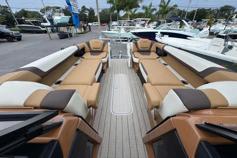  Yacht Photos Pics Luxurious 2026 Avalon Excalibur 27' boat interior with tan and white seating.