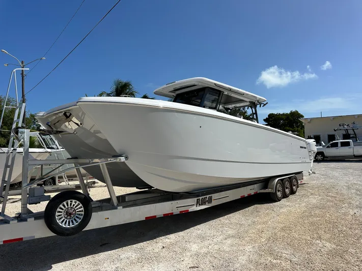  Yacht Photos Pics 2026 Twin Vee 400 GFX2 CC boat on trailer under clear blue sky.