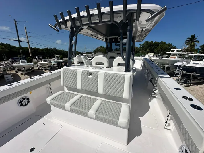  Yacht Photos Pics 2026 Twin Vee 400 GFX2 CC boat interior with cushioned seating and rod holders.