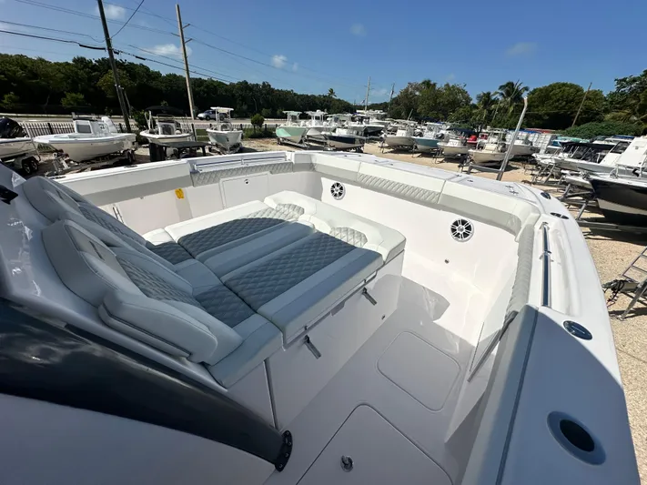  Yacht Photos Pics 2026 Twin Vee 400 GFX2 CC boat interior with cushioned seating and sleek design.