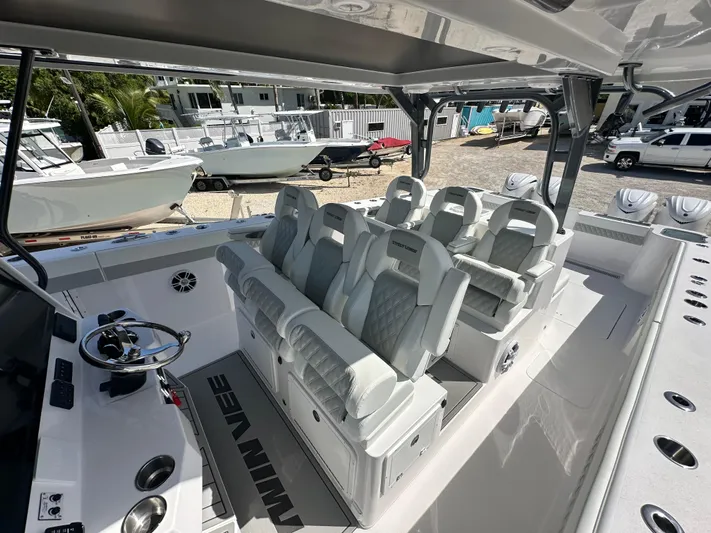  Yacht Photos Pics 2026 Twin Vee 400 GFX2 CC boat interior with luxurious seating and modern helm controls.
