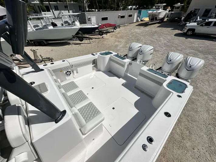  Yacht Photos Pics 2026 Twin Vee 400 GFX2 CC boat with quad engines, spacious deck, and seating area.