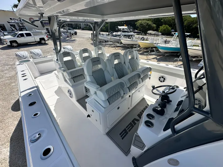  Yacht Photos Pics 2026 Twin Vee 400 GFX2 CC boat interior with luxurious seating and modern controls.