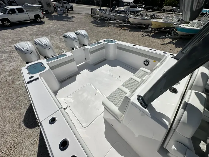  Yacht Photos Pics 2026 Twin Vee 400 GFX2 CC boat interior with four outboard motors, spacious seating, and storage.