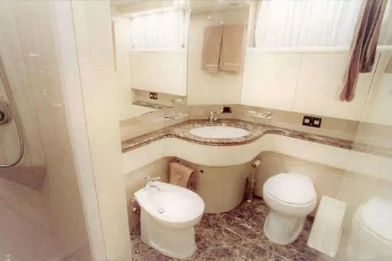  Yacht Photos Pics Luxurious bathroom in 1998 Maiora MAIORA 29 DP yacht with marble accents.