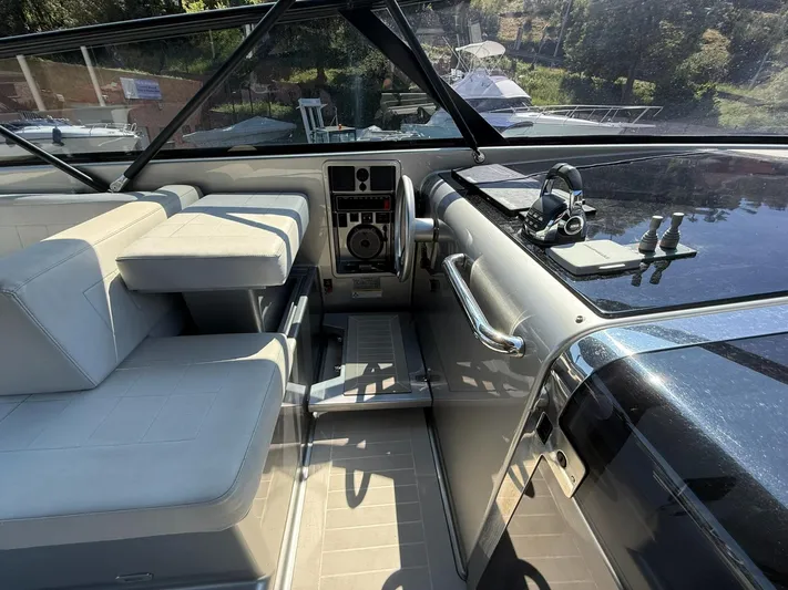  Yacht Photos Pics Interior of 2019 VanDutch 55 yacht with modern seating and control panel.