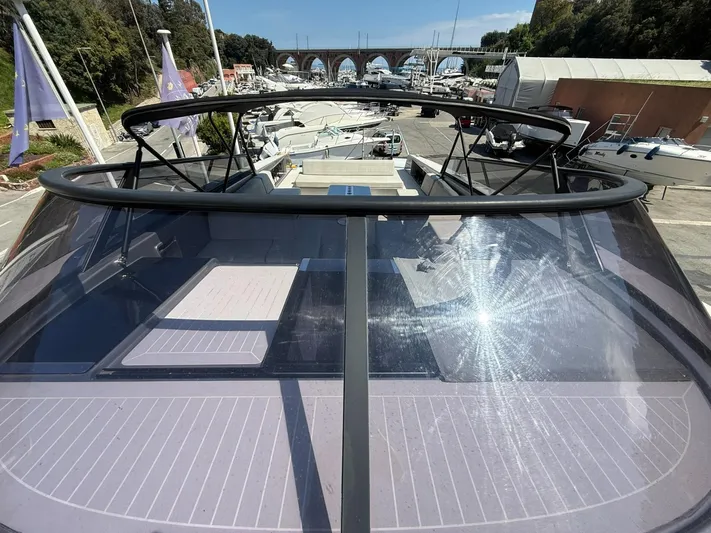  Yacht Photos Pics 2019 VanDutch 55 yacht with sleek design, docked in a marina under sunny skies.