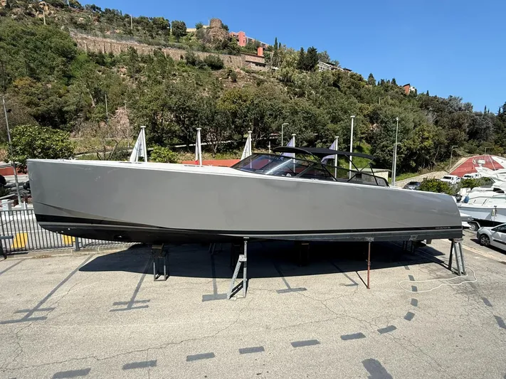  Yacht Photos Pics 2019 VanDutch 55 yacht on stands, sleek design, outdoor setting, clear sky.