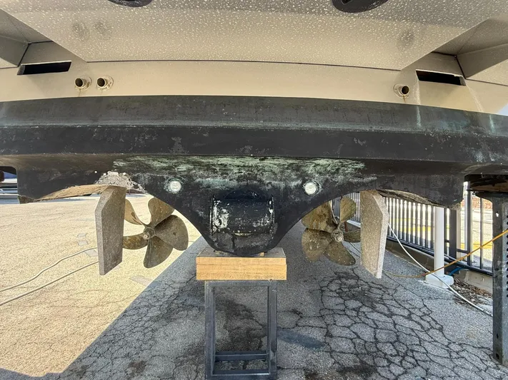  Yacht Photos Pics 2019 VanDutch 55 yacht underside with visible propellers and rudders on a stand.