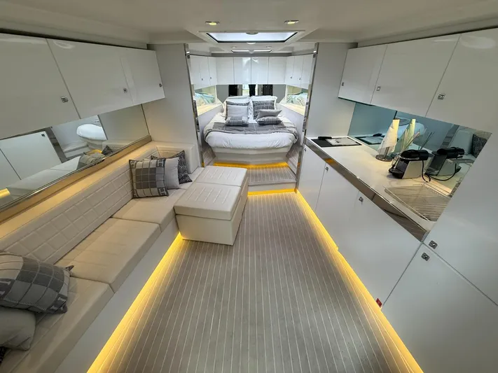  Yacht Photos Pics Luxurious interior of 2019 VanDutch 55 yacht with modern design and ambient lighting.